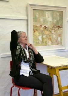 A quiet moment beside a painting during the retreat.